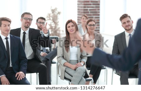 leader of the business people giving a speech in a conference room