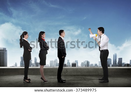 Leader give order via megaphone to his subordinate. Business communication concept