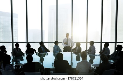 Leader Talking To Business Team At Meeting Table