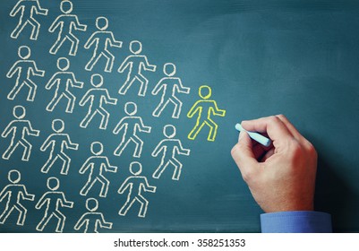 leadership concept male hand drawing group of people and leader - Powered by Shutterstock