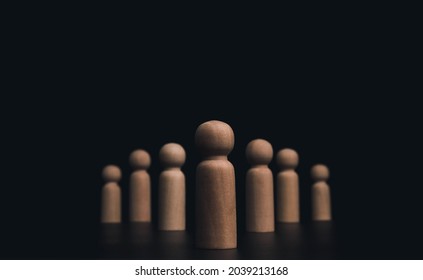 Leadership concept, manager, CEO, market leader, Influencer, opinion leader, and business leading. Leader wooden figures with followers line up in orderly on dark background with copy space. - Powered by Shutterstock