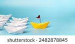 Leadership Concept with Paper Boats. Set of colorful origami ships on blue background. Business competition, Leadership concept with yellow paper ship leading among white.