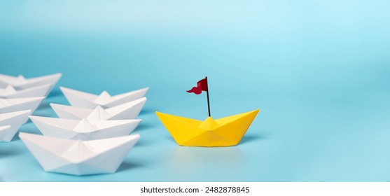 Leadership Concept with Paper Boats. Set of colorful origami ships on blue background. Business competition, Leadership concept with yellow paper ship leading among white. - Powered by Shutterstock