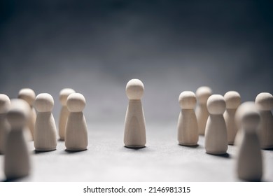 Leadership concept, wooden business team with one person standing out from the crowd