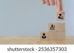 Leadership, job promotion, recognition and organizational structure. Wooden blocks representing a personal development, talent management, business  leader and job promotion.