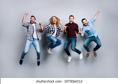 Leadership network leisure rest relax recreation enjoy vacation stag party people concept. Four dreamy funky delightful screaming football fans gesturing jumping up isolated on gray background