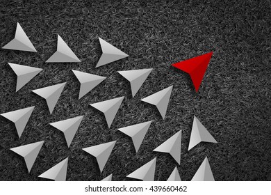 Leadership And Synergy Concept  : A Number Of White Paper Arrow Against A Bright Black Texture Background Lead By A Red Arrow Leader