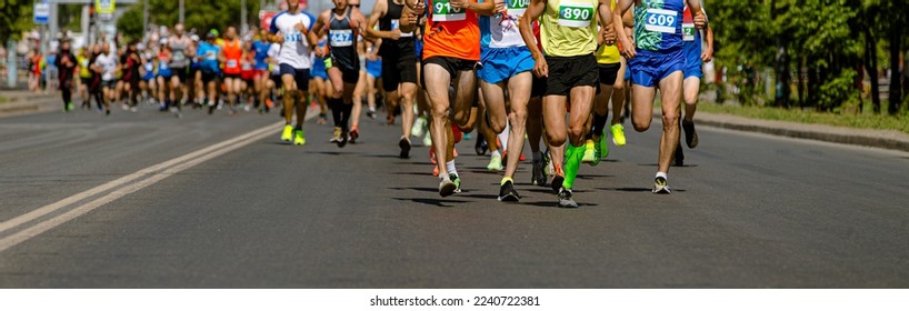 leading group runners run city marathon - Powered by Shutterstock