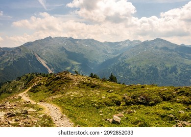 Leading Line Dirt Hiking Trail View On A Mountaintop In Innsbruck, Tyrol, Austria, On A Sunny Summer Day