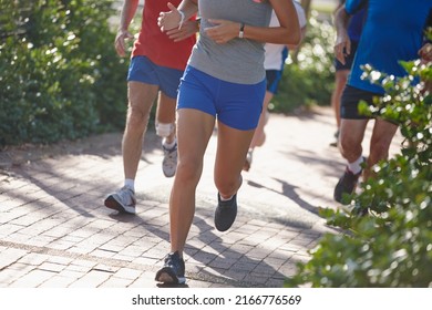 Leading The Pack. Cropped Shot Of A Group Of People Running.