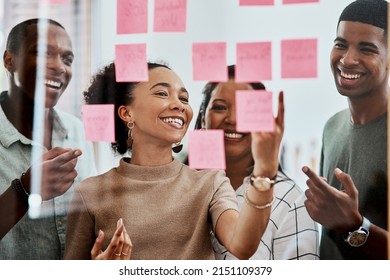 Leading the way in creative innovation. Shot of a group of young businesspeople having a brainstorming session in a modern office. - Shutterstock ID 2151109379