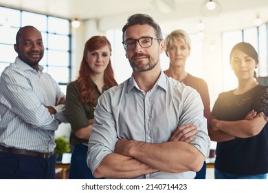 Leading The Way To Excellence. Portrait Of A Group Of Designers Standing In An Office.