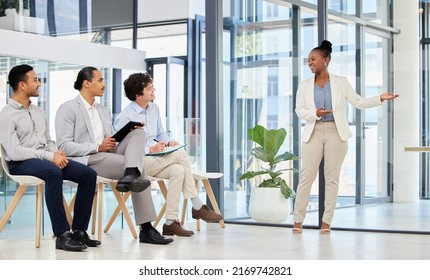 Leading The Way To Marketing Success. Shot Of A Group Of People Waiting To Be Interviewed For A Job At A Modern Office.