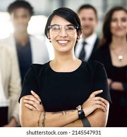 Leading The Way In Our Industry. Cropped Portrait Of A Group Of Businesspeople Standing In The Office.