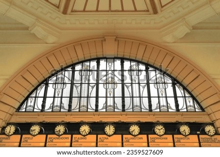 Leadlight window situated ''above the clocks'' over the entrance to the main ticket hall of the Flinders Street Railway Station viewed from the inside looking back out. Melbourne-VIC-Australia.