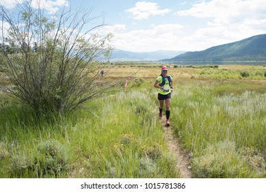 LEADVILLE, COLORADO USA - AUGUST 19, 2017: Raquel Harper Outbound From The Twin Lakes Aid Station During The Leadville Trail 100 Ultra, Leadville, Colorado, USA.