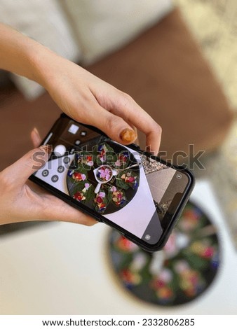 Similar – Image, Stock Photo Young hands taking photos with smartphones to vegetable skewers