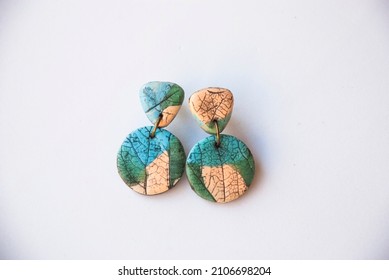 Leaf stamp earrings of polymer clay. Handmade jewelry. - Powered by Shutterstock