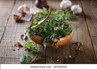 Leafy Green Mix Of Kale, Spinach, Baby Beetroot Leaves Over Rustic Wooden Background