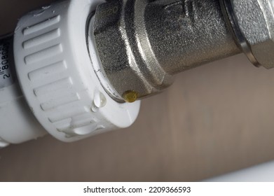 Leakage Heating System. Problem With Water Leakage At The Junction Of Pipes And Radiators Of The Home Heating System. Water Leakage With Poor Tightness Of Threaded Pipe Connections. Selective Focus