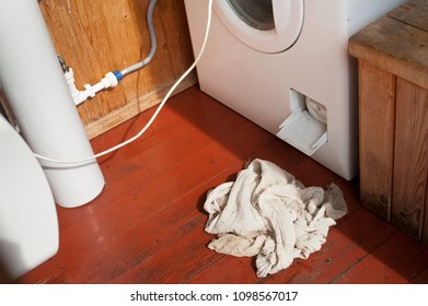 A Leaking Washing Machine And Cloth, Angled Closeup