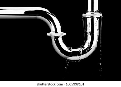 Leaking of water from stainless steel sink pipe on isolated on black background
