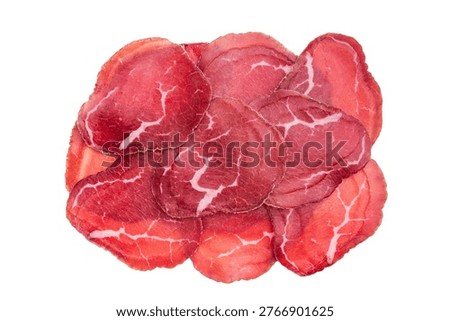 Lean cured beef cut thin like Italian bresaola, premium delicacy presented on bright white surface