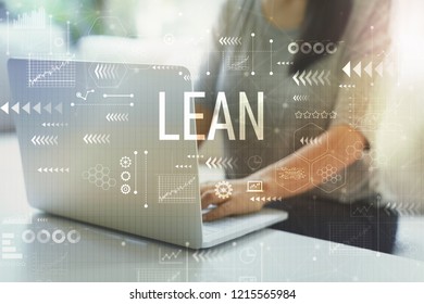 Lean with woman using her laptop in her home office