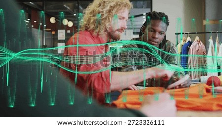 Leaning three men pointing at tablet and discussing orange garment on work table, waveform overlay. Fabric, collaboration, designstudio, fashion, touchscreen, brainstorming, productivity