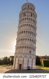 The Leaning Tower of Pisa, the sun rising in the background - Shutterstock ID 2256829727