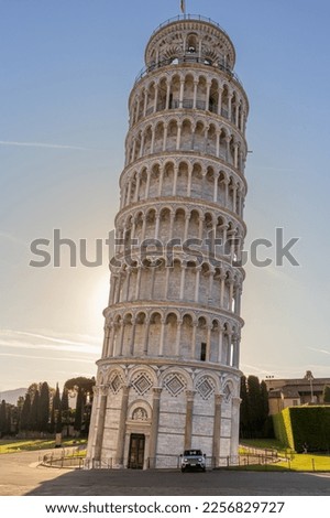 The Leaning Tower of Pisa, the sun rising in the background