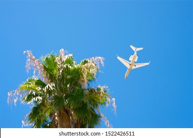 Lear Jet Flying Over Head In A Tropical Area 