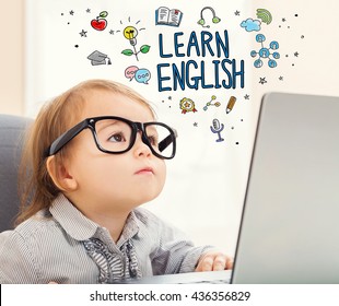 Learn English Concept With Toddler Girl Using Her Laptop