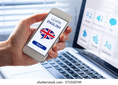 Learn English Language Online Concept With A Person Showing E-learning App On Mobile Phone With The British Flag Of The United Kingdom