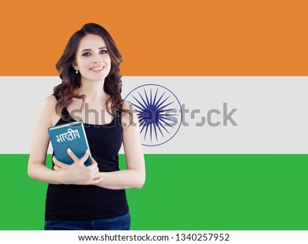 Learn hindi language. Attractive woman student with the India flag