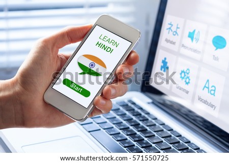 Learn Hindi language online concept with a person showing e-learning app on mobile phone with the flag of India