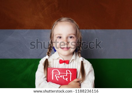 Learn hindi language. Smart child student on India flag background