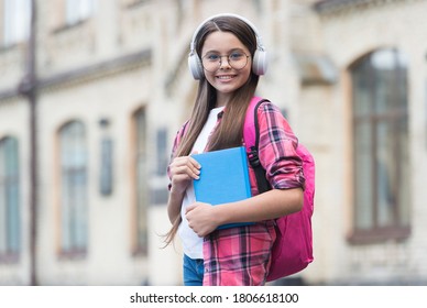 Learn language when travel. Happy kid wear headphones. Learning foreign language. English school. Audio lesson. Online courses. Private teaching. Non-formal education. Language proficiency. - Shutterstock ID 1806618100