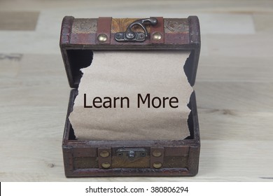 Learn More Is Written On The Brown Torn Paper In The Treasure Box