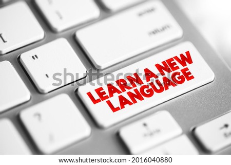 Learn A New Language text button on keyboard, concept background