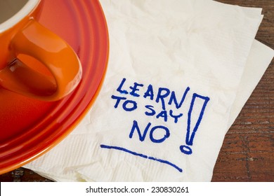 Learn To Say No Advice - Handwriting On A Napkin With Cup Of Coffee