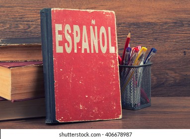 learn spanish concept. book on a wooden background
