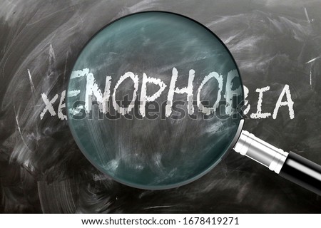 Learn, study and inspect xenophobia - pictured as a magnifying glass enlarging word xenophobia, symbolizes researching, exploring and analyzing meaning of xenophobia, 3d illustration