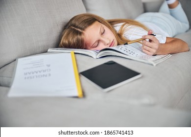 Learner Dozing Off For A Bit At A Couch Using English Studying Materials As A Pillow