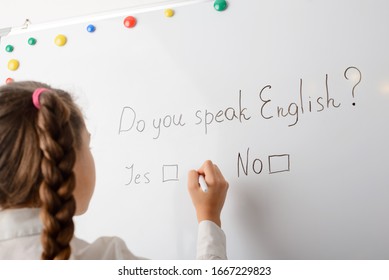 Learner of secondary school thinking about the question whether she can speak English. Concept of international language
