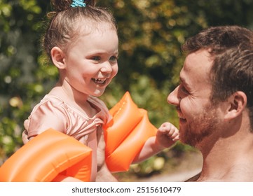 Learning, activity and child with swimming instructor in pool for lesson, education or practice in summer. Happy, outdoor and teacher with kid in water for aquatic exercise, growth or development. - Powered by Shutterstock