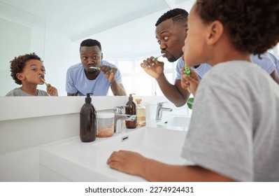 Learning, brushing teeth and father with son in bathroom for dental, morning routine and cleaning. Teaching, self care and toothbrush with black man and child at home for wellness, fresh and hygiene - Powered by Shutterstock