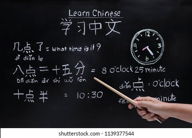 Learning Chinese To Tell Time In Class Room.