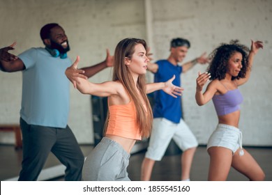 Learning choreography. A group of people learning to dance jazz-funk - Powered by Shutterstock