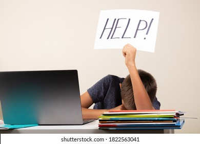 Learning Difficulties, School, Education, Online Remote Learning Concept. Sad Kid With Laptop Computer Holding Card With Help Word